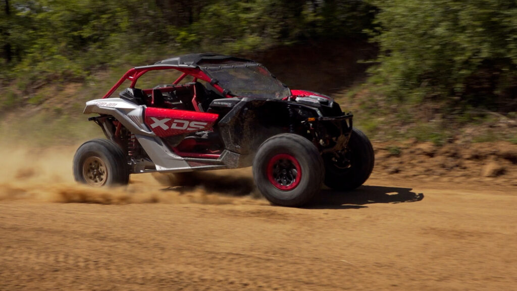 2026 Can-Am Maverick X3 X DS Turbo RR with Smart-Shox showing turbocharged Rotax engine performance on the trail