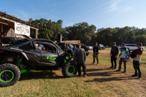 UTV On Demand editor and test driver Ed Teixeira standing in front of the 2027 Kawasaki TERYX H2 LIMITED eS at Durhamtown.