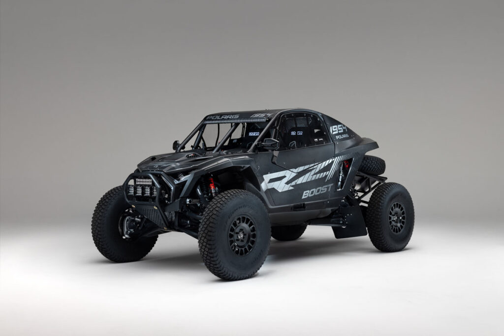 Three-quarter front view of the Polaris RZR Pro R Factory Boost with carbon fiber race bodywork.