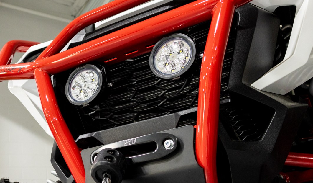 LED lights mounted in the red HMF Honda Talon HD front bumper